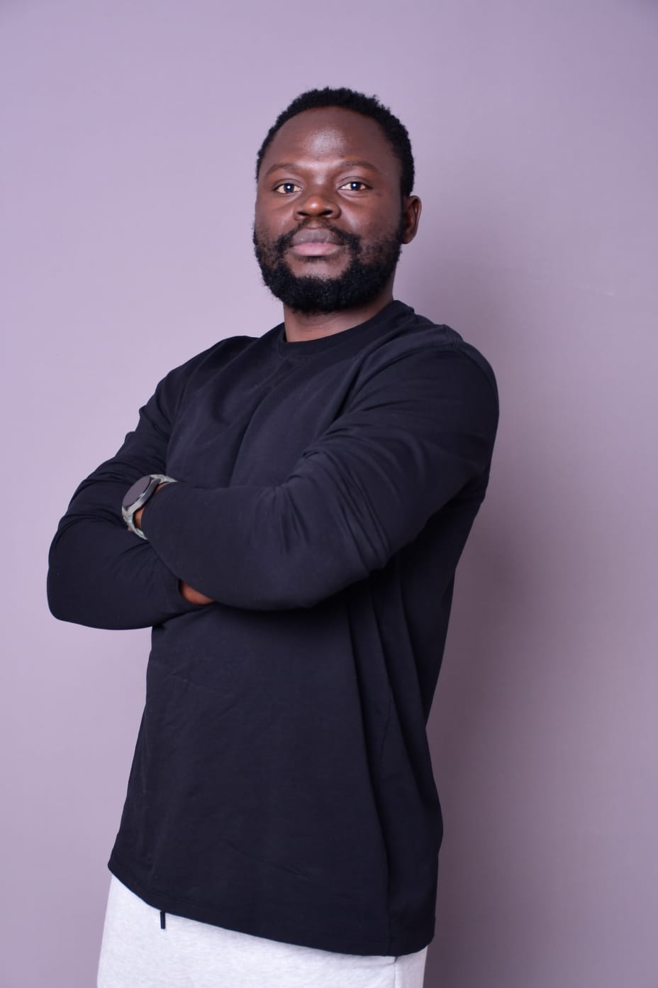 Portrait of Cetric Okola, CTO, Founder, Systems Architect, and product technology leader.